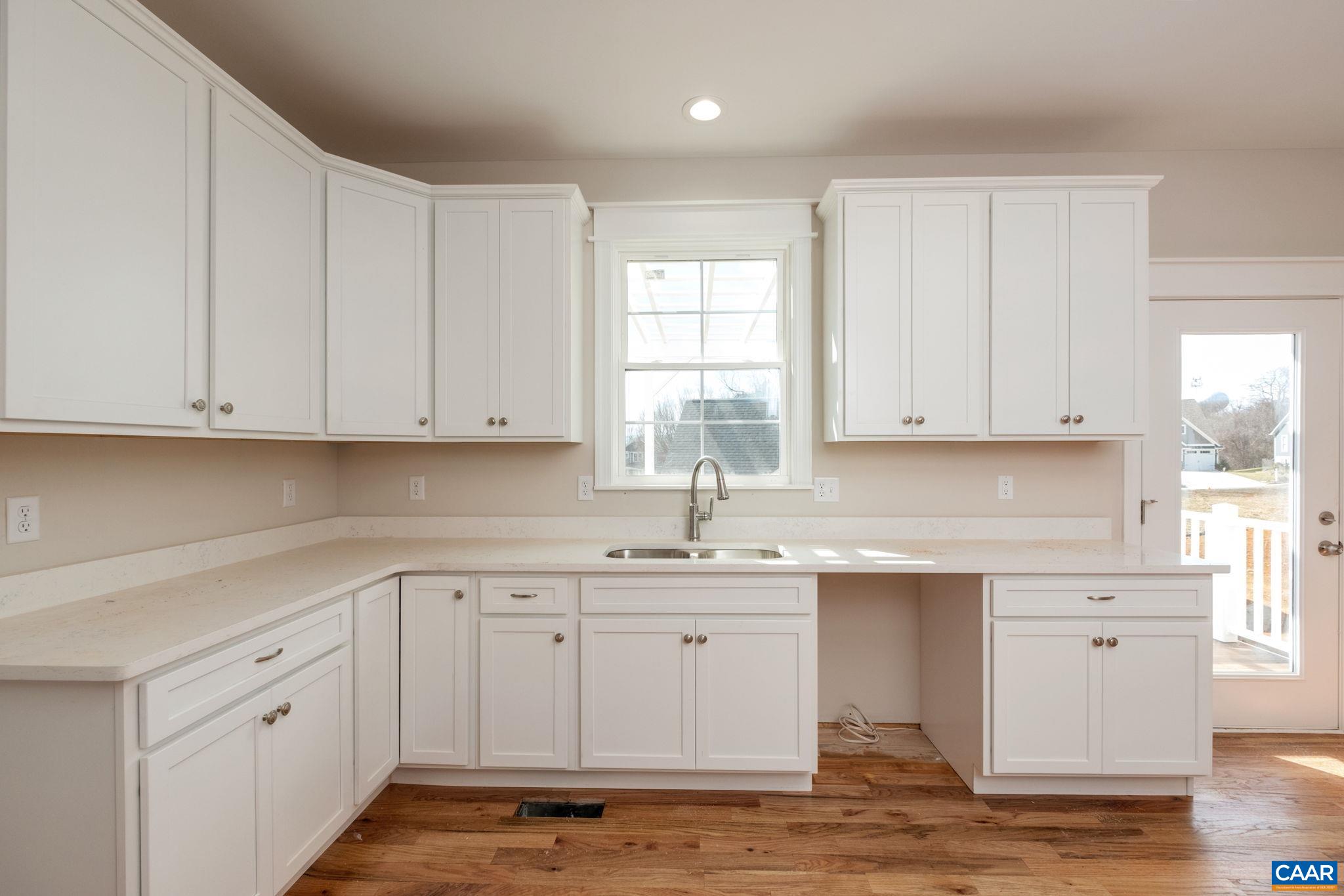 1004 High Point Court Waynesboro, VA 22980 - Photo 12 of 39 a kitchen with white cabinets sink and window