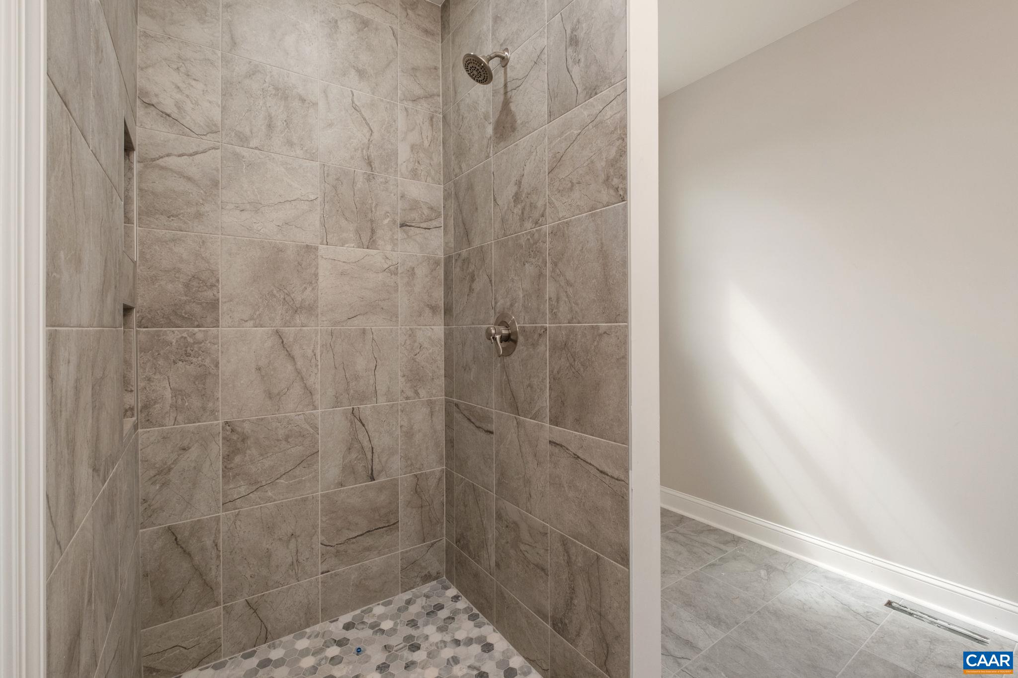 1004 High Point Court Waynesboro, VA 22980 - Photo 15 of 39 Tiled shower in the primary bathroom.
