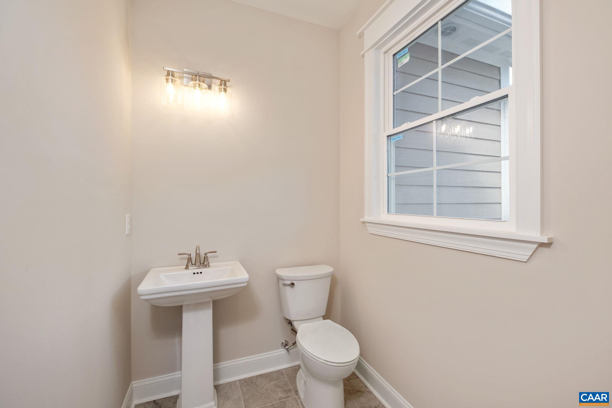 1004 High Point Court Waynesboro, VA 22980 - Photo 18 of 39 a bathroom with a sink a toilet and a window
