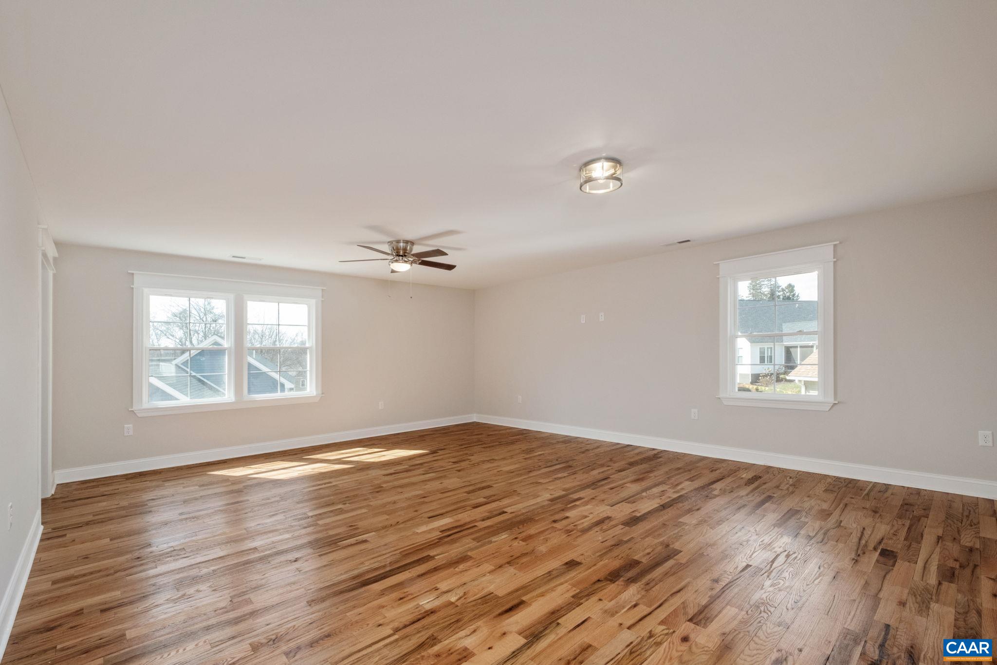 1004 High Point Court Waynesboro, VA 22980 - Photo 19 of 39 a view of empty room with wooden floor and fan