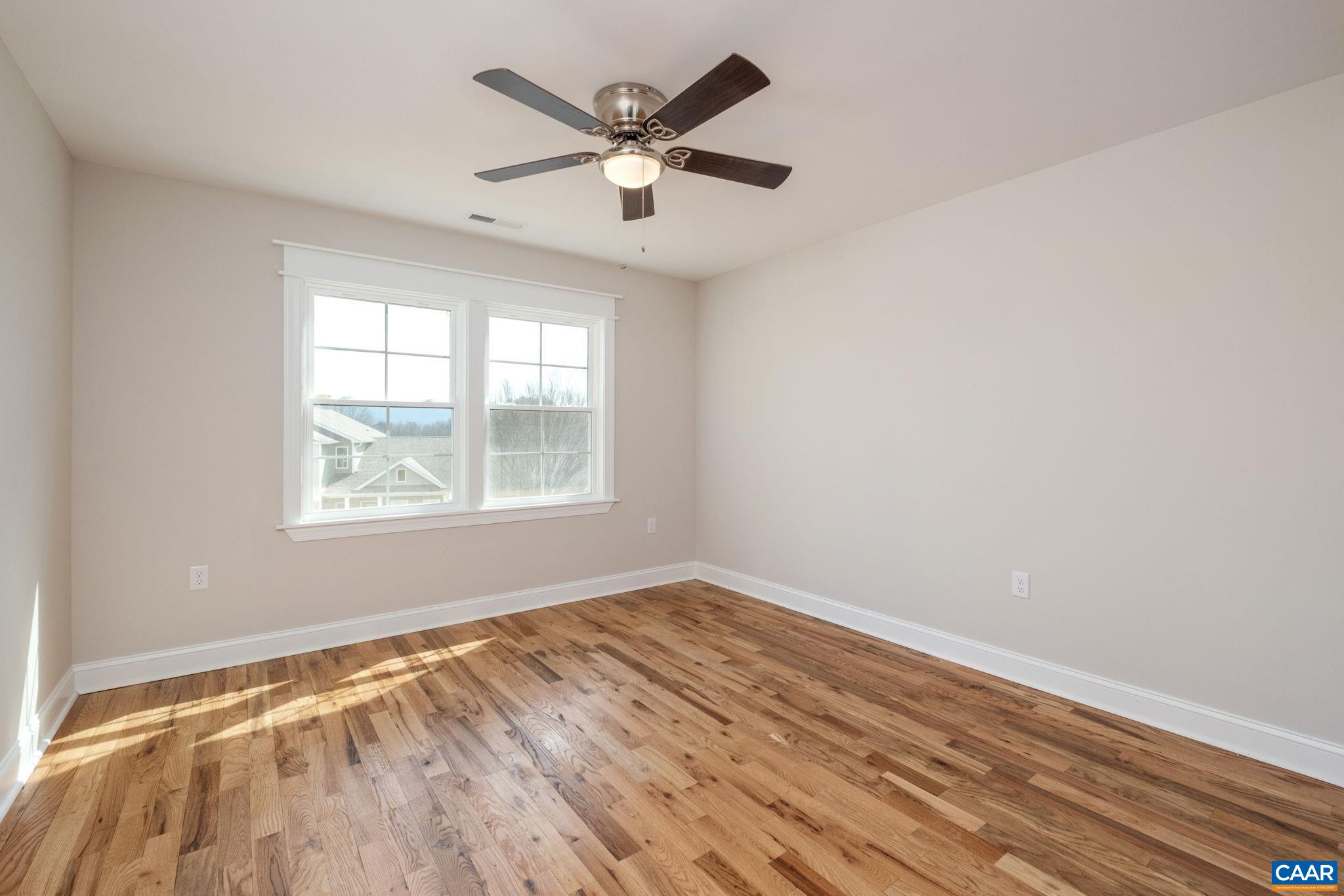1004 High Point Court Waynesboro, VA 22980 - Photo 23 of 39 an empty room with wooden floor and windows
