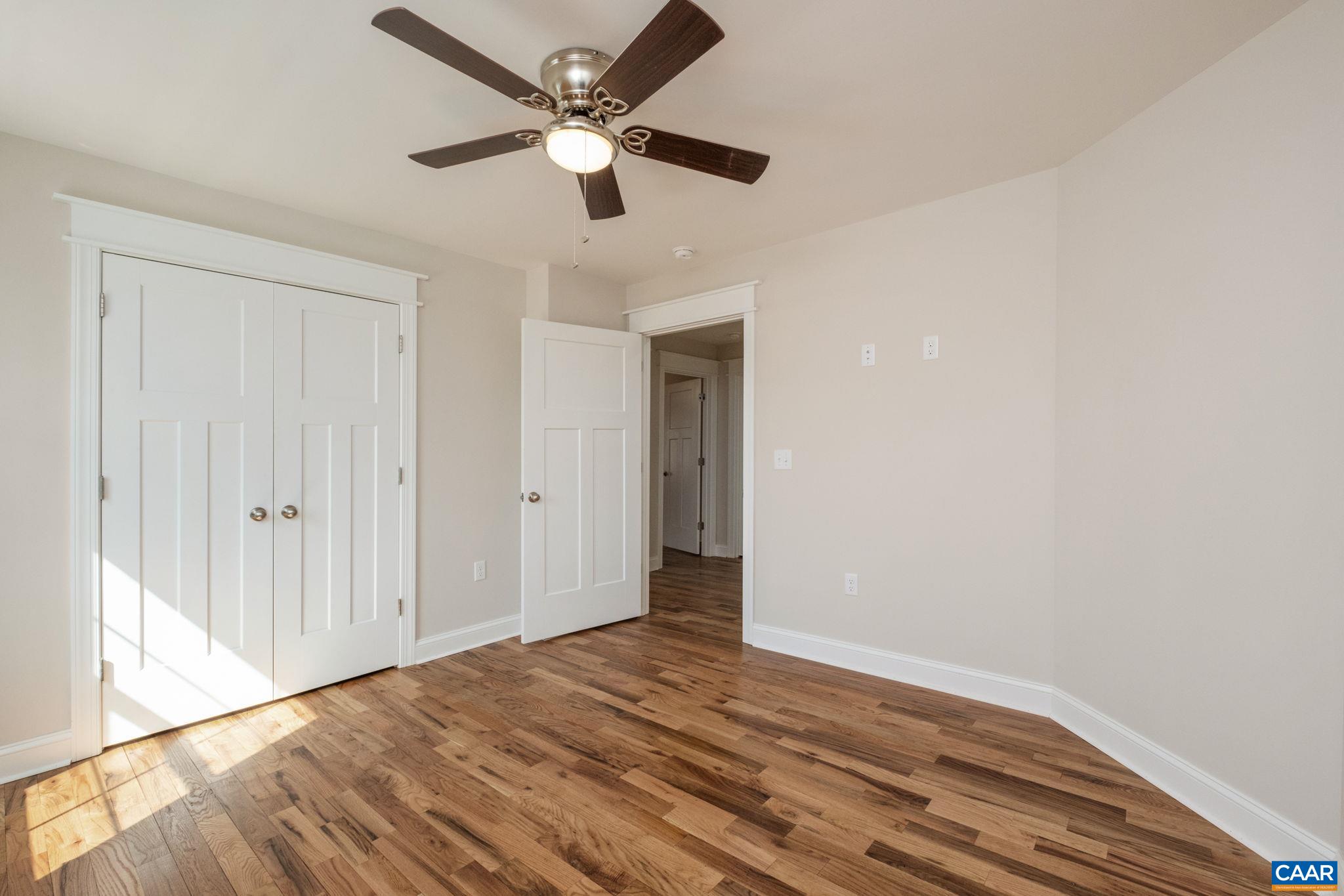 1004 High Point Court Waynesboro, VA 22980 - Photo 26 of 39 an empty room with wooden floor and ceiling fan