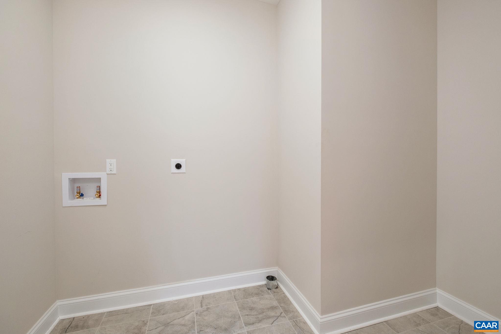 1004 High Point Court Waynesboro, VA 22980 - Photo 27 of 39 The laundry room is located on the main level, near the primary bedroom.