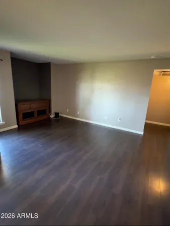 a view of a kitchen with kitchen island and a sink