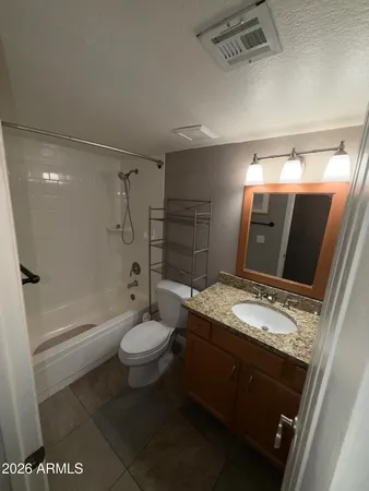 a bathroom with a toilet and shower