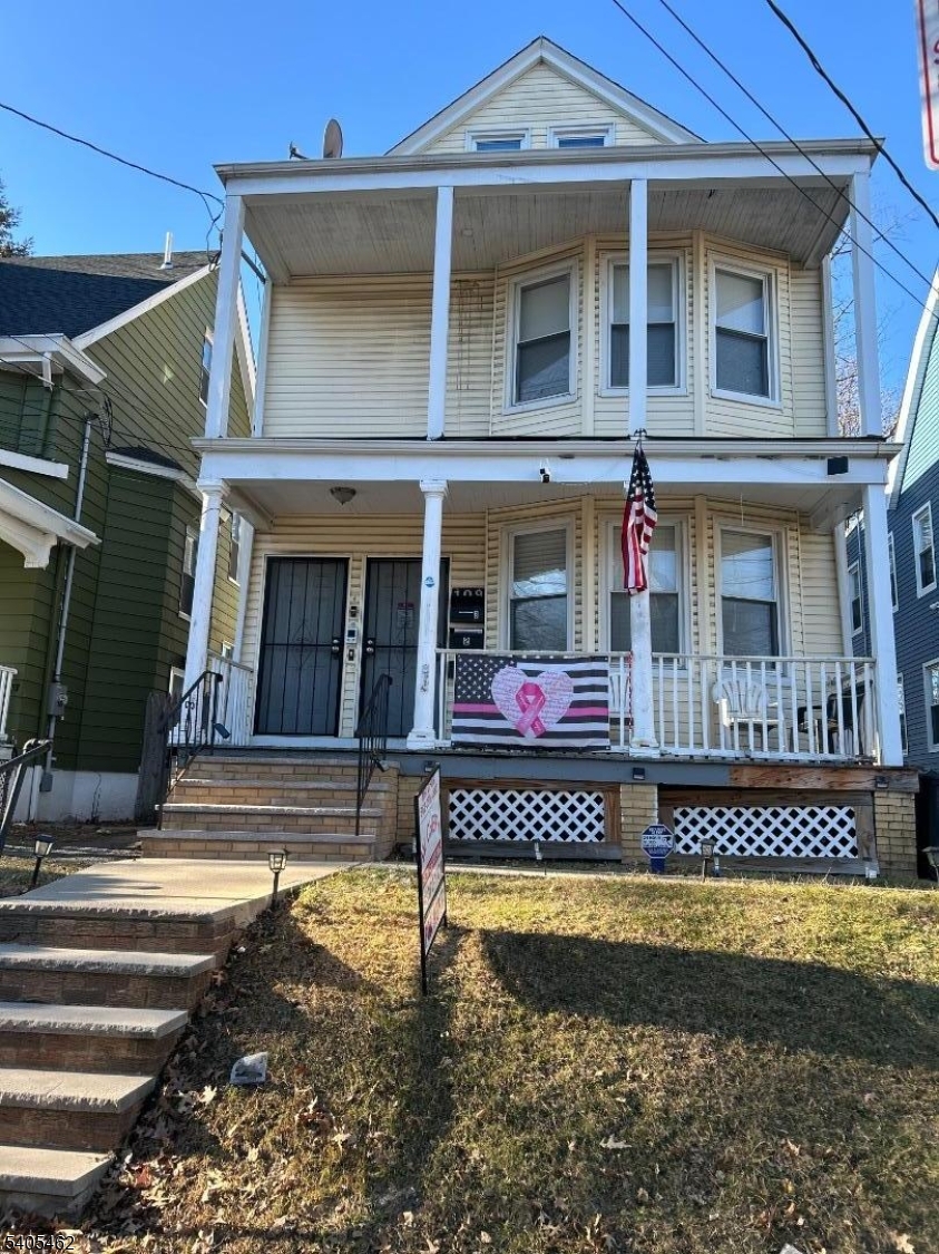 a front view of a house with a swimming pool