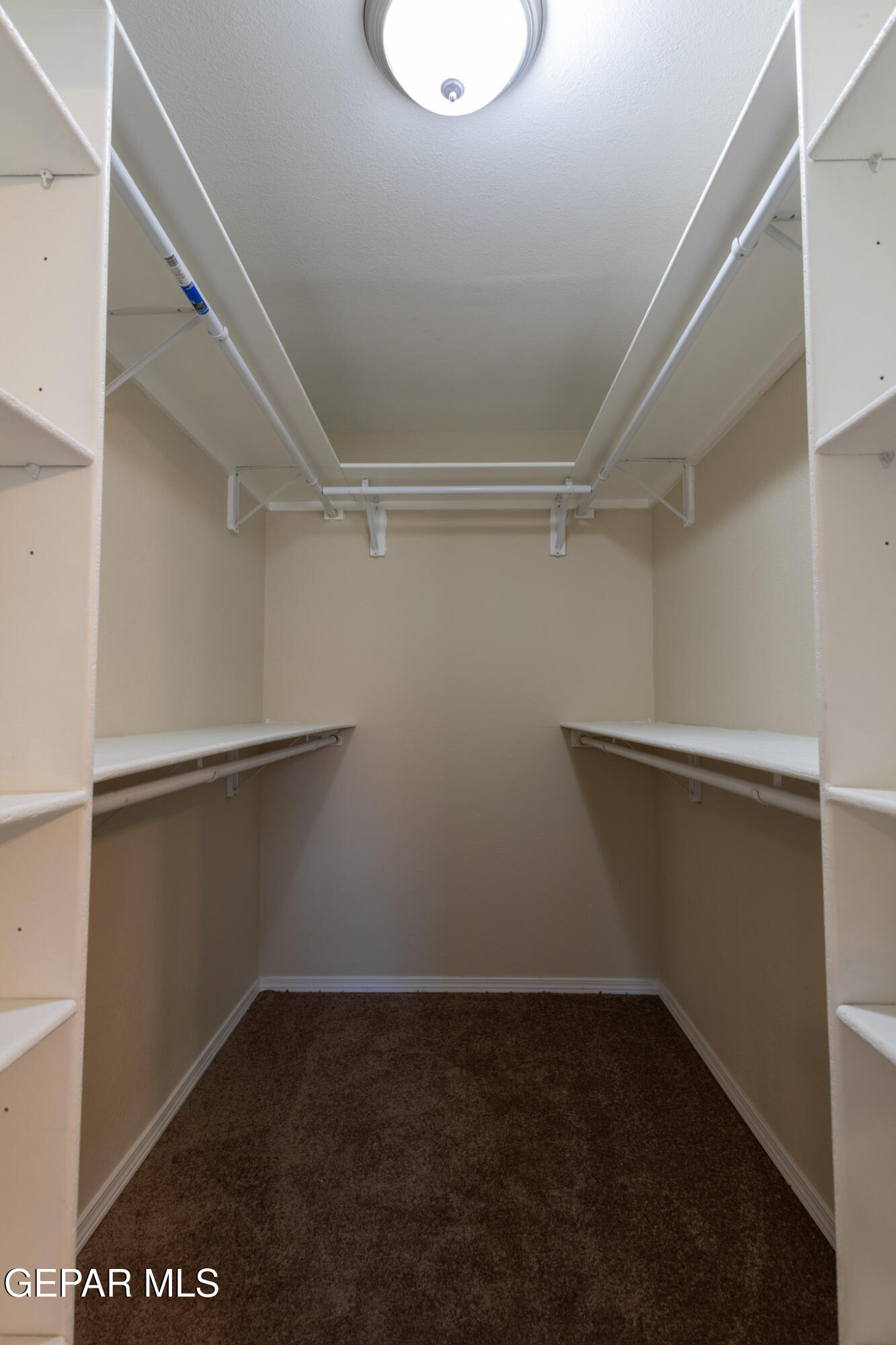 14829 Kingston Road Horizon City, TX 79928 - Photo 28 of 34 a view of an empty walk in closet