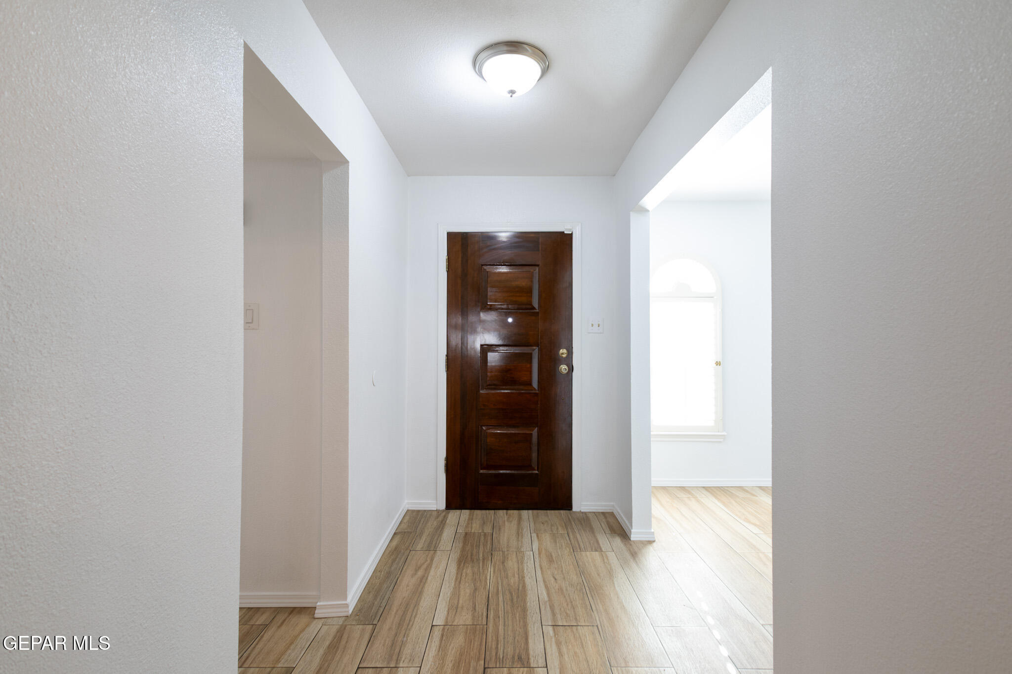 14829 Kingston Road Horizon City, TX 79928 - Photo 5 of 34 a view of a hallway with wooden floor and closet