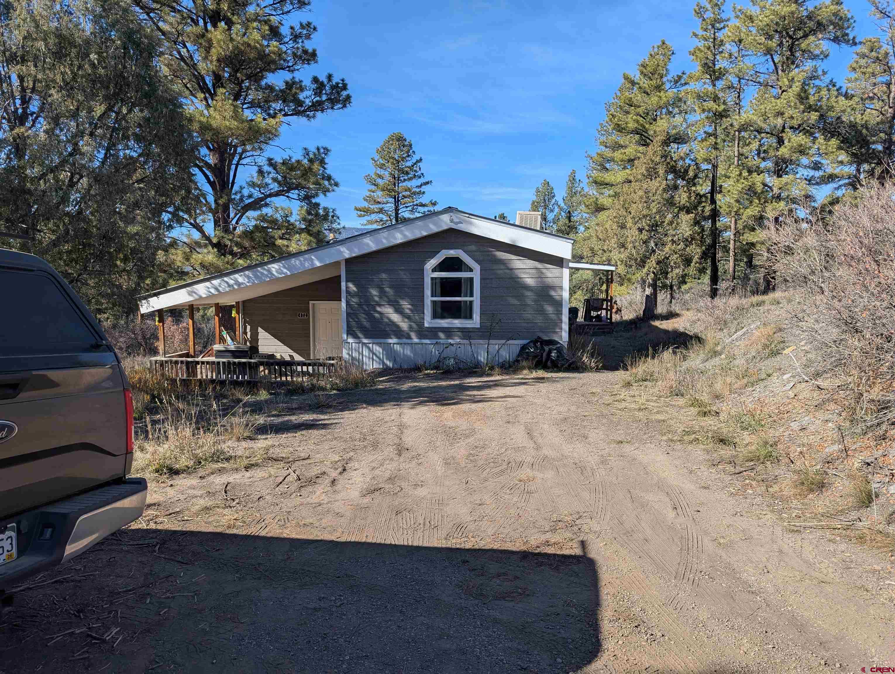 472 Haystack Circle Pagosa Springs, CO 81147 - Photo 1 of 31 a view of a house with a yard covered in snow