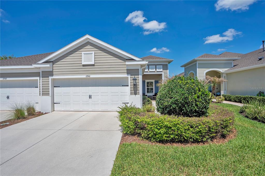 13541 Circa Crossing Drive Lithia, FL 33547 - Photo 1 of 52 a front view of a house with a yard