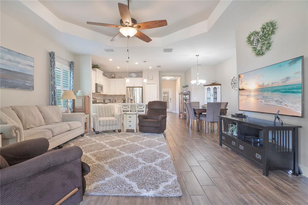 13541 Circa Crossing Drive Lithia, FL 33547 - Photo 18 of 52 a living room with furniture and a wooden floor
