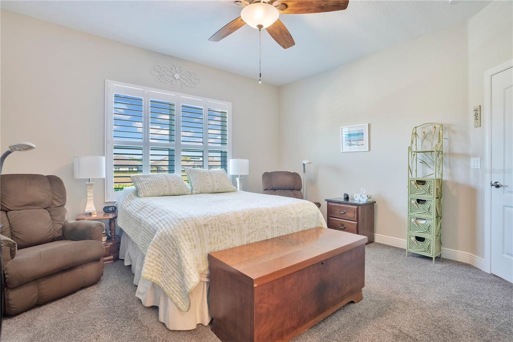 13541 Circa Crossing Drive Lithia, FL 33547 - Photo 21 of 52 a bedroom with a bed and a couch