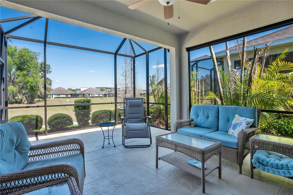 13541 Circa Crossing Drive Lithia, FL 33547 - Photo 25 of 52 a living room with furniture and a floor to ceiling window