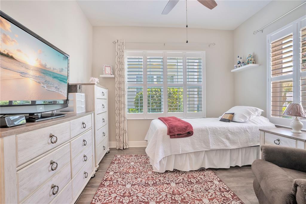 13541 Circa Crossing Drive Lithia, FL 33547 - Photo 9 of 52 a bedroom with bed and flat screen tv