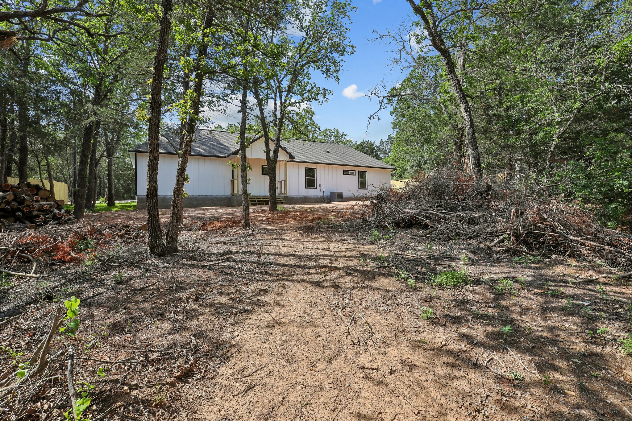 210 Flint Ridge Street Bastrop, TX 78602 - Photo 38 of 40 a house is sitting in middle of the forest