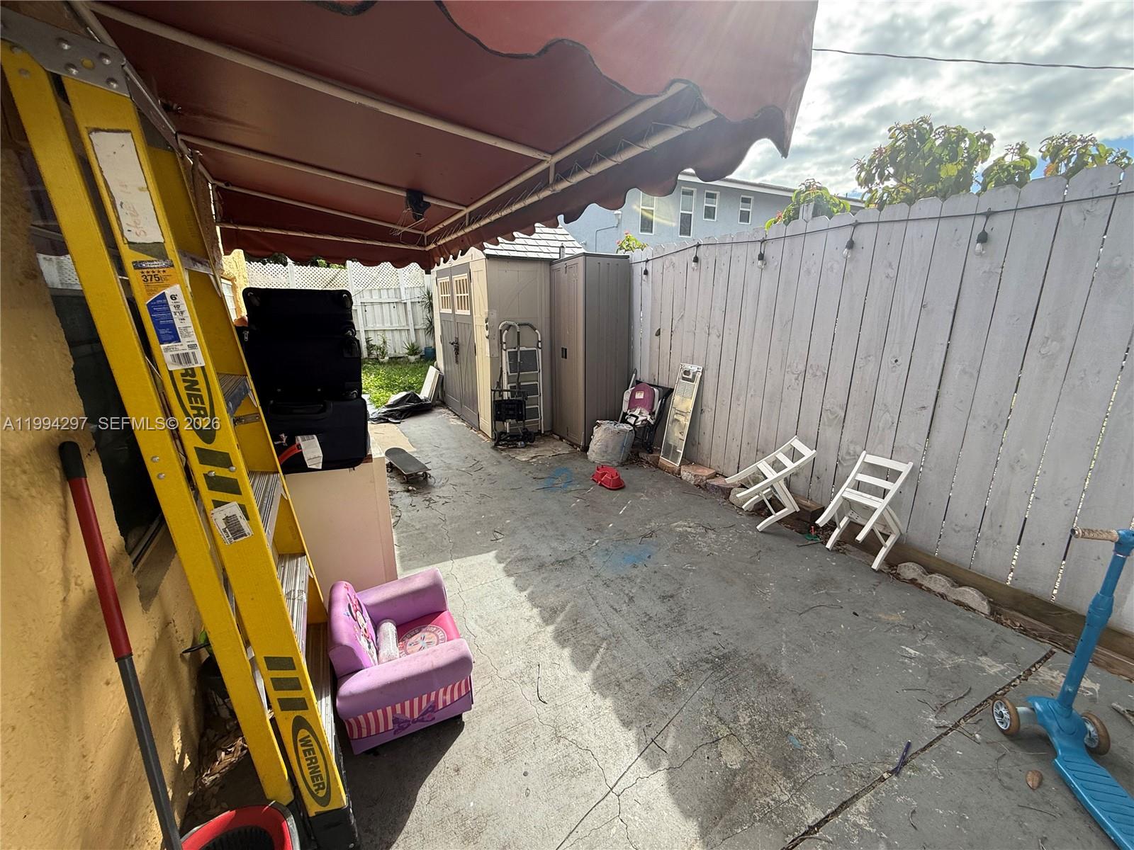 3674 Southwest 25th Street Miami, FL 33133 - Photo 14 of 15 a backyard of a house with outdoor seating