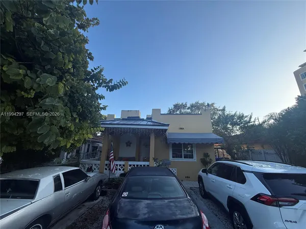 a front view of house with outdoor seating
