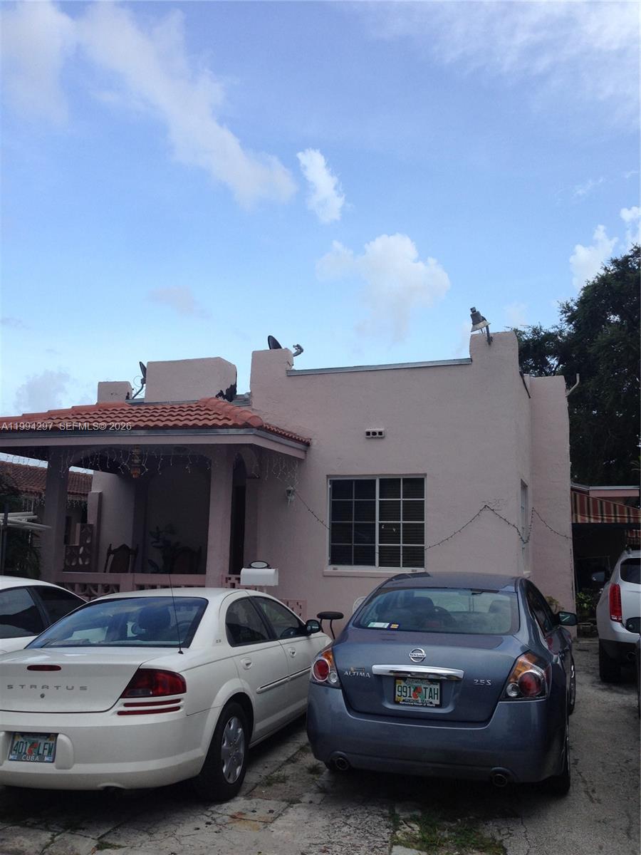 3674 Southwest 25th Street Miami, FL 33133 - Photo 5 of 15 a view of a car parked in front of a house