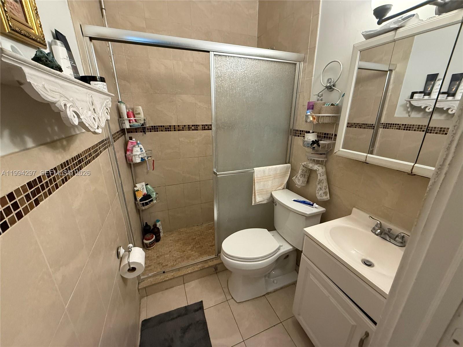 3674 Southwest 25th Street Miami, FL 33133 - Photo 8 of 15 a bathroom with a sink toilet and shower