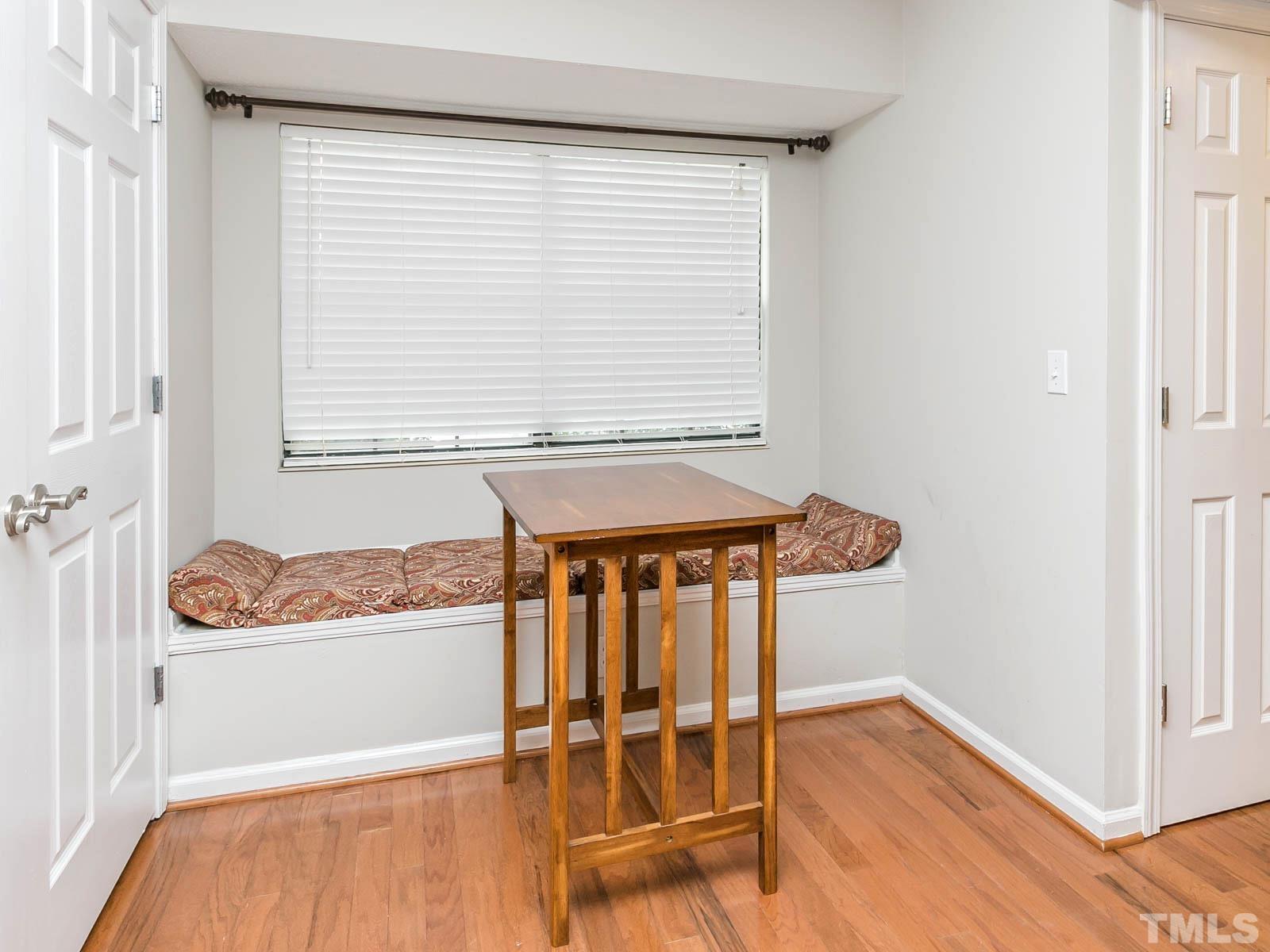 7738 Falcon Rest Circle Raleigh, NC 27615 - Photo 10 of 18 a view of a room with wooden floor and a window
