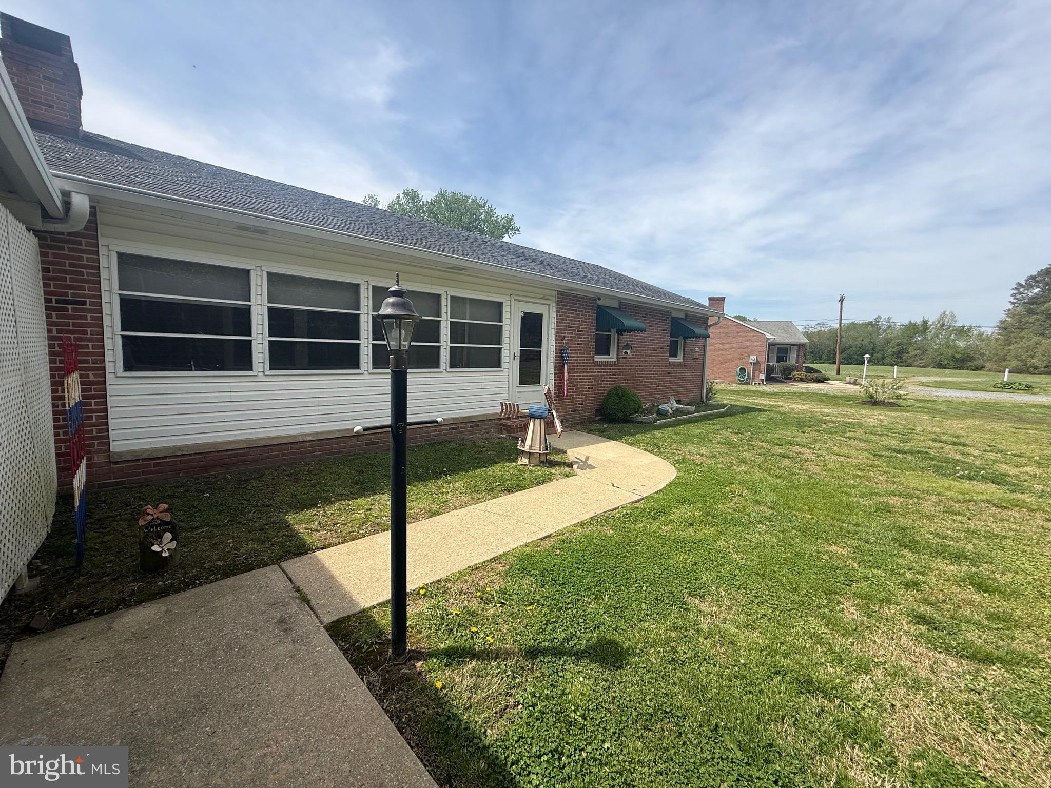 9108 Glebe Creek Road Easton, MD 21601 - Photo 2 of 19 a view of a house with backyard and porch