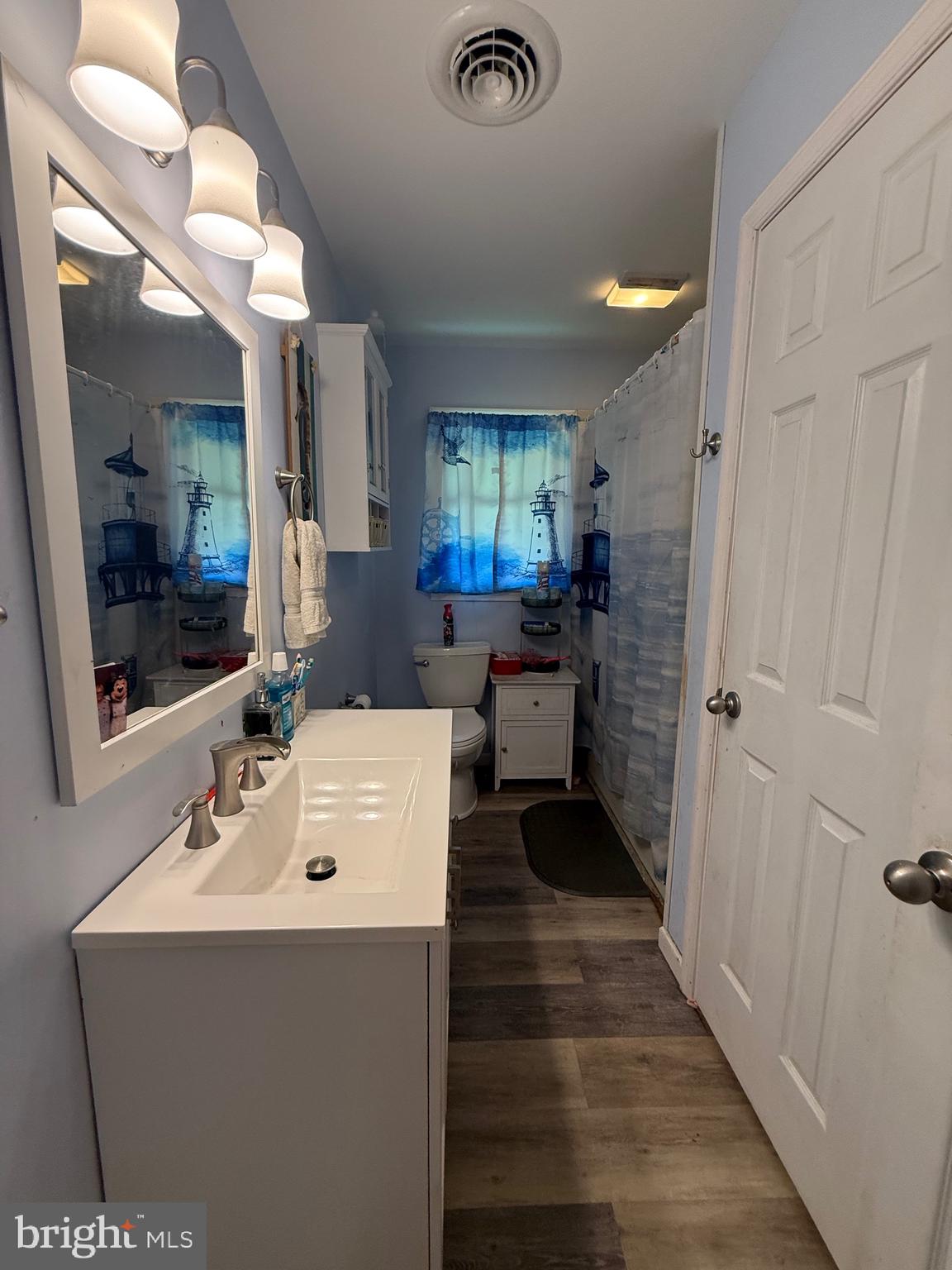9108 Glebe Creek Road Easton, MD 21601 - Photo 10 of 19 a en suite bathroom with a sink mirror and shower
