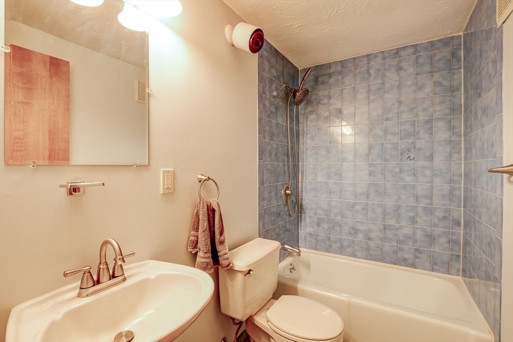 205 East Rindge Road Ashburnham, MA 01430 - Photo 24 of 40 a bathroom with a sink toilet and shower