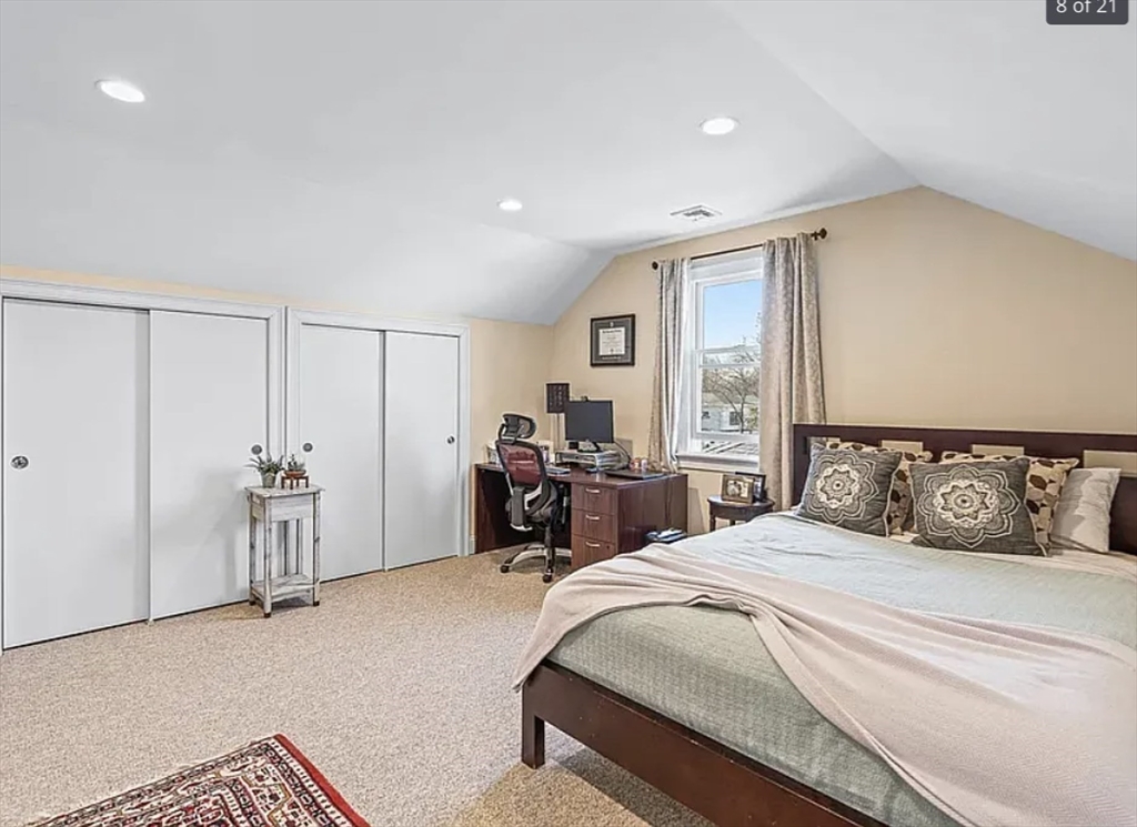 58 Spiers Road Newton, MA 02459 - Photo 15 of 19 a bedroom with a large bed and a chandelier