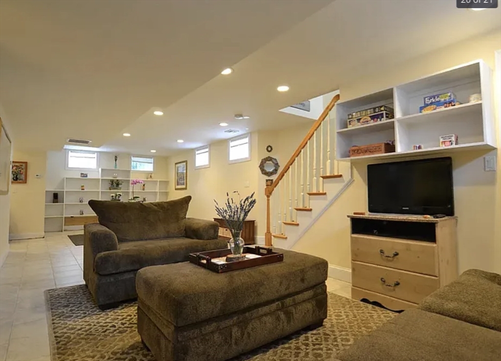 58 Spiers Road Newton, MA 02459 - Photo 16 of 19 a living room with furniture and a flat screen tv