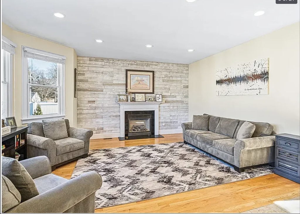 58 Spiers Road Newton, MA 02459 - Photo 2 of 19 a living room with furniture and a fireplace