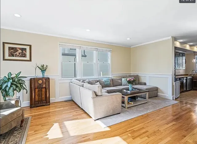 a living room with furniture and a rug