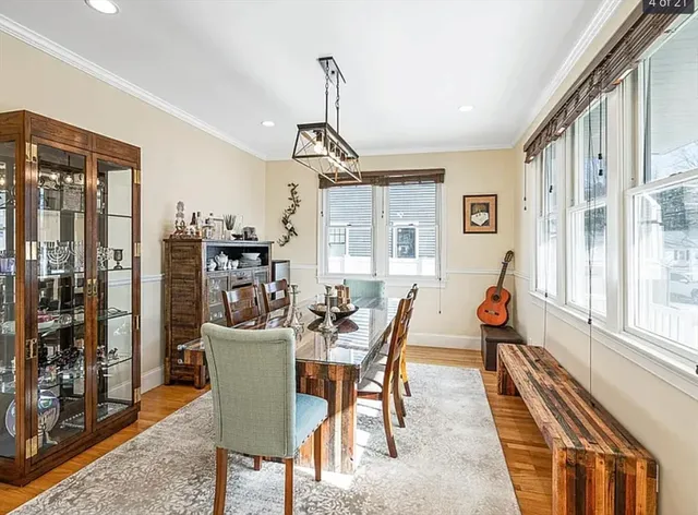a view of a dining room with furniture window and wooden floor