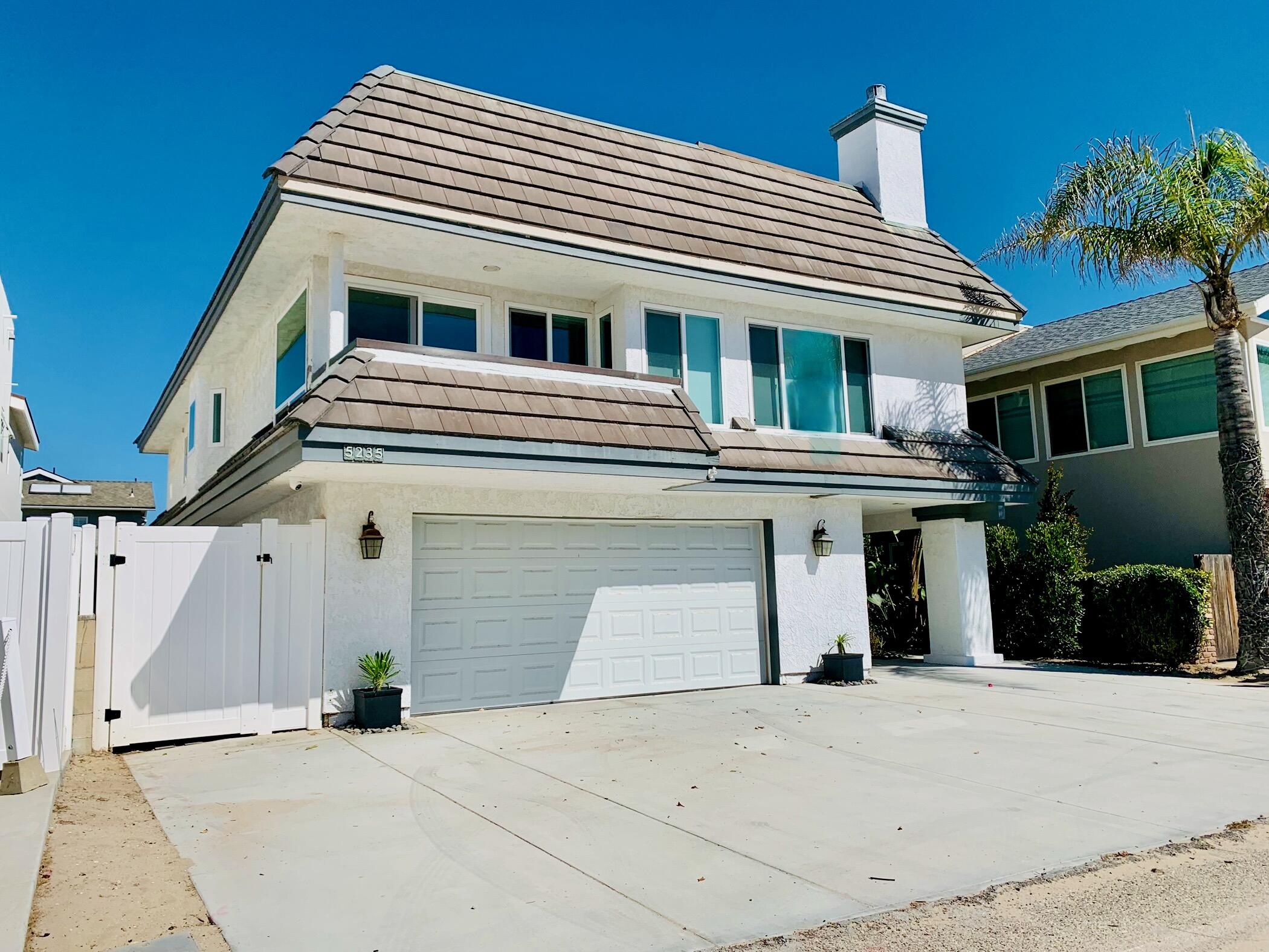 5235 Sealane Way Oxnard, CA 93035 - Photo 1 of 57 a front view of a house with a garage