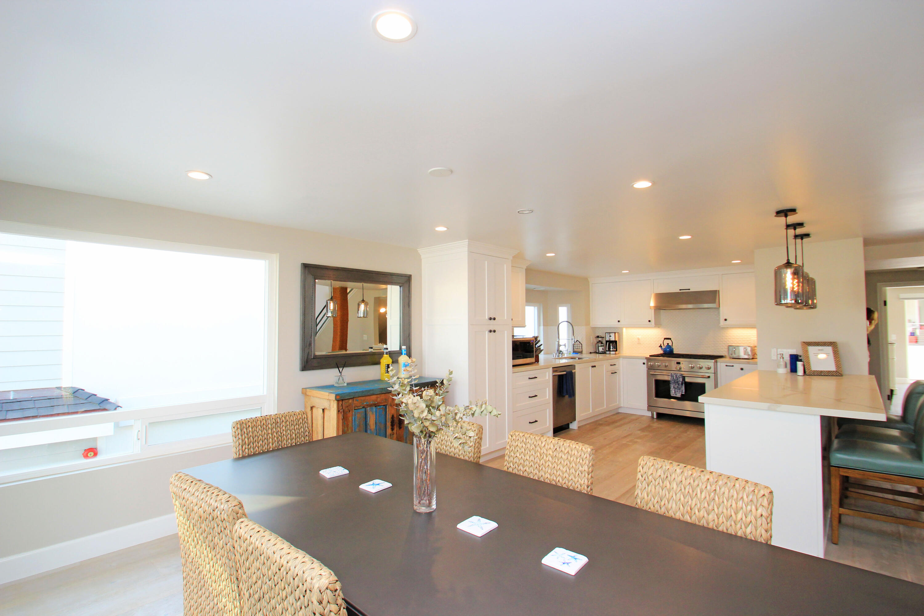 5235 Sealane Way Oxnard, CA 93035 - Photo 13 of 57 a large living room with stainless steel appliances furniture a rug and a kitchen view