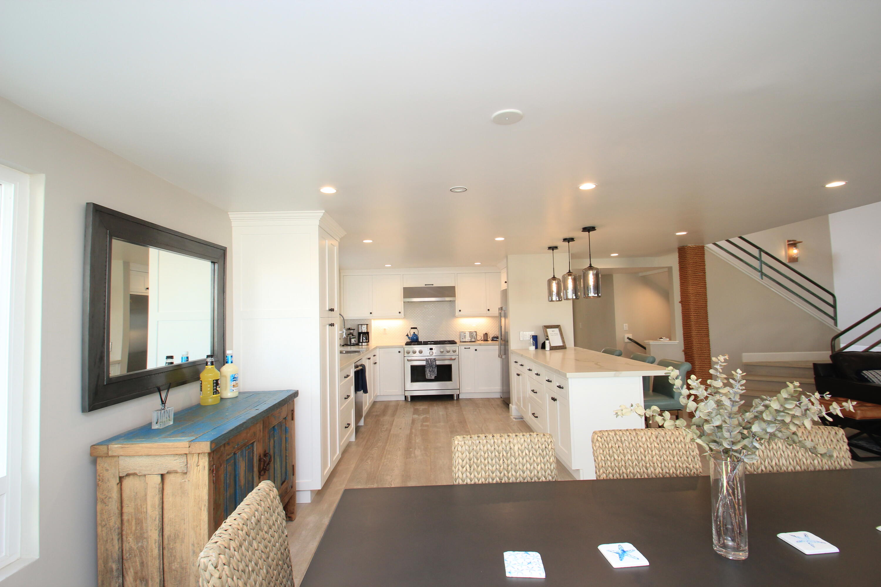5235 Sealane Way Oxnard, CA 93035 - Photo 14 of 57 a living room with furniture kitchen view and a chandelier