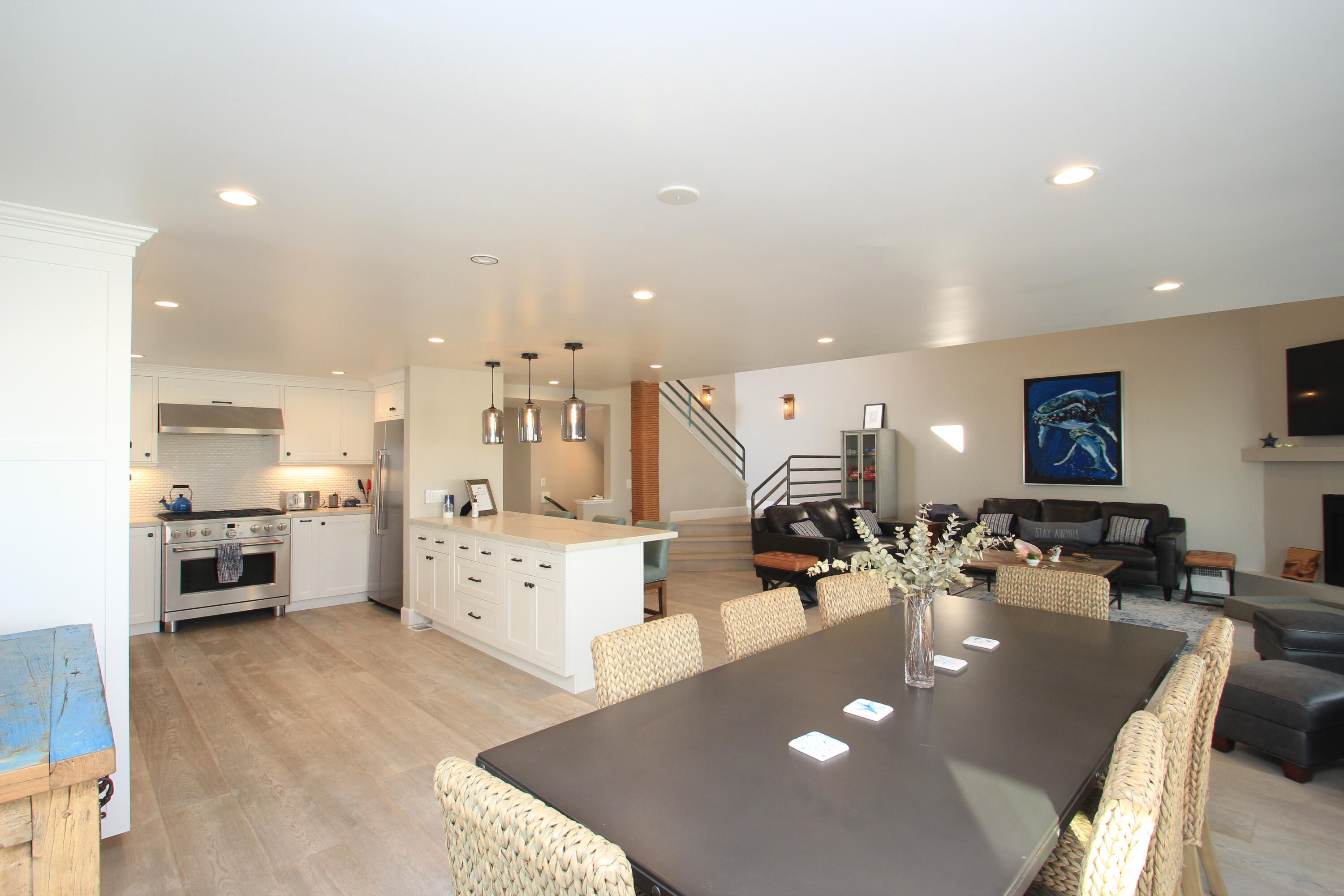 5235 Sealane Way Oxnard, CA 93035 - Photo 18 of 57 a large white kitchen with a large counter top appliances and cabinets