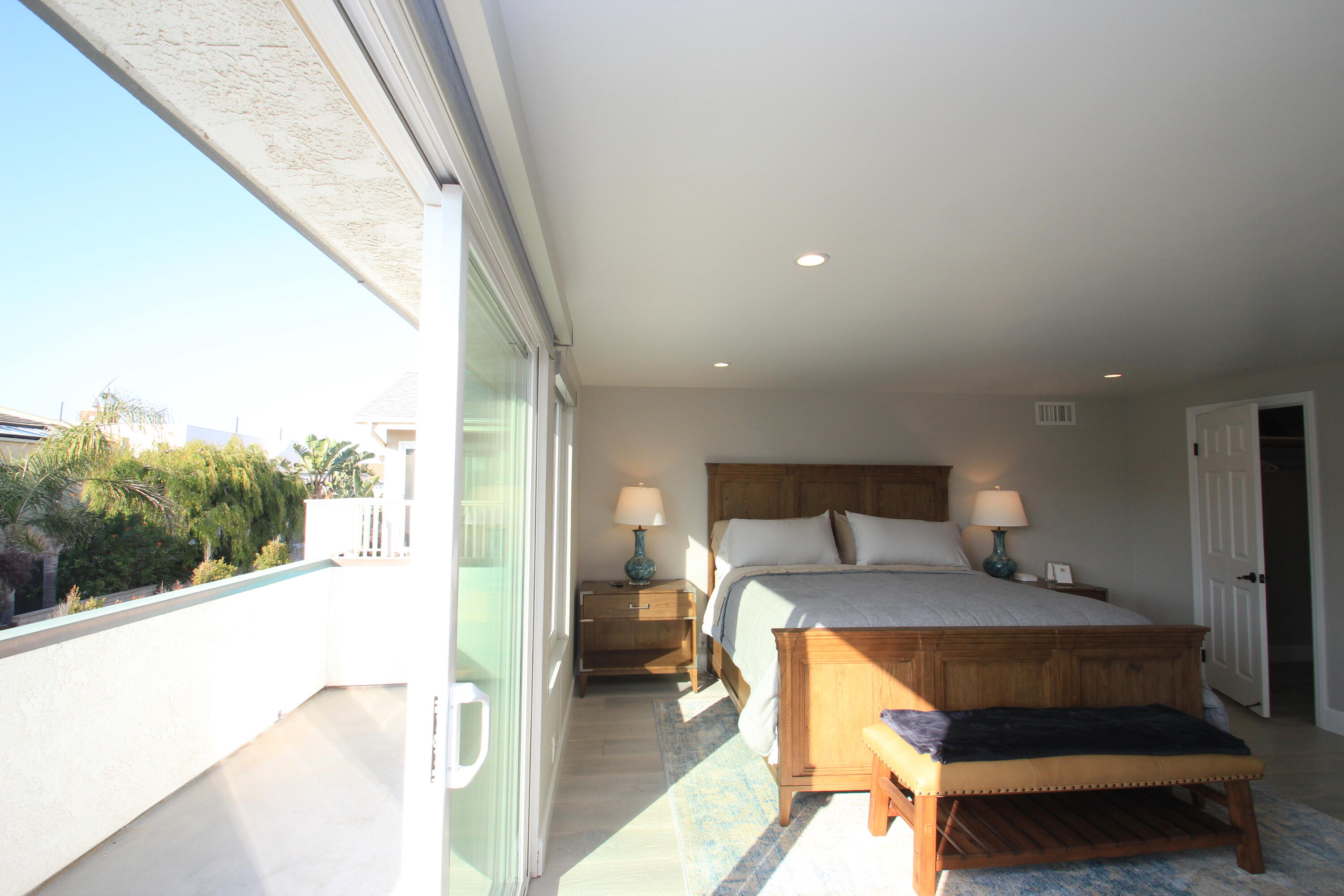5235 Sealane Way Oxnard, CA 93035 - Photo 23 of 57 a living room with furniture and a floor to ceiling window