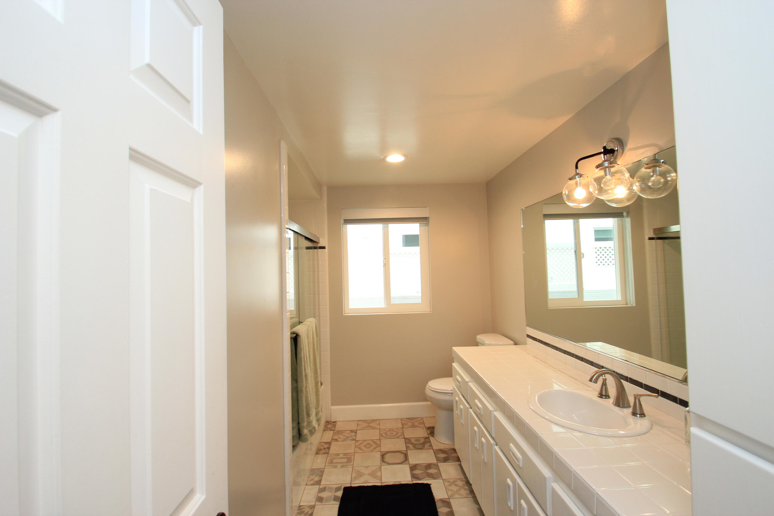 5235 Sealane Way Oxnard, CA 93035 - Photo 38 of 57 a bathroom with a sink a toilet and shower