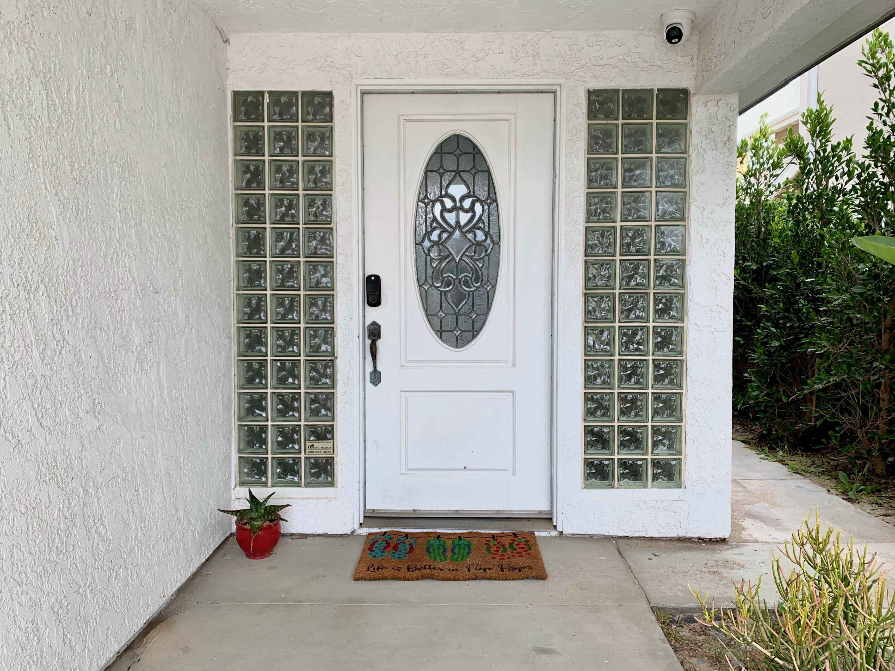 5235 Sealane Way Oxnard, CA 93035 - Photo 4 of 57 a front view of a house with garden