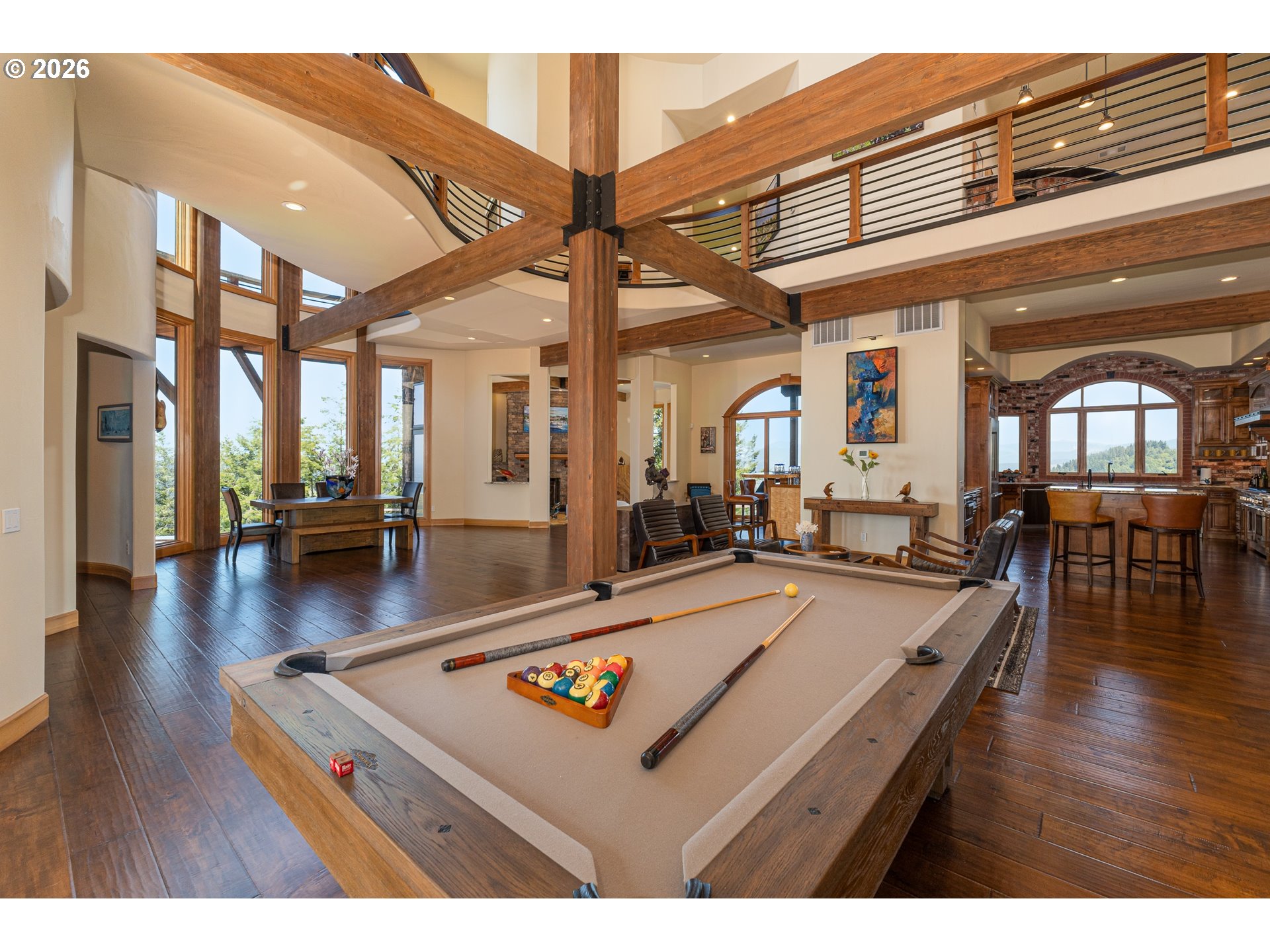 94880 Grizzly Mountain Road Gold Beach, OR 97444 - Photo 13 of 48 a living room with furniture pool table wooden floor and a large window