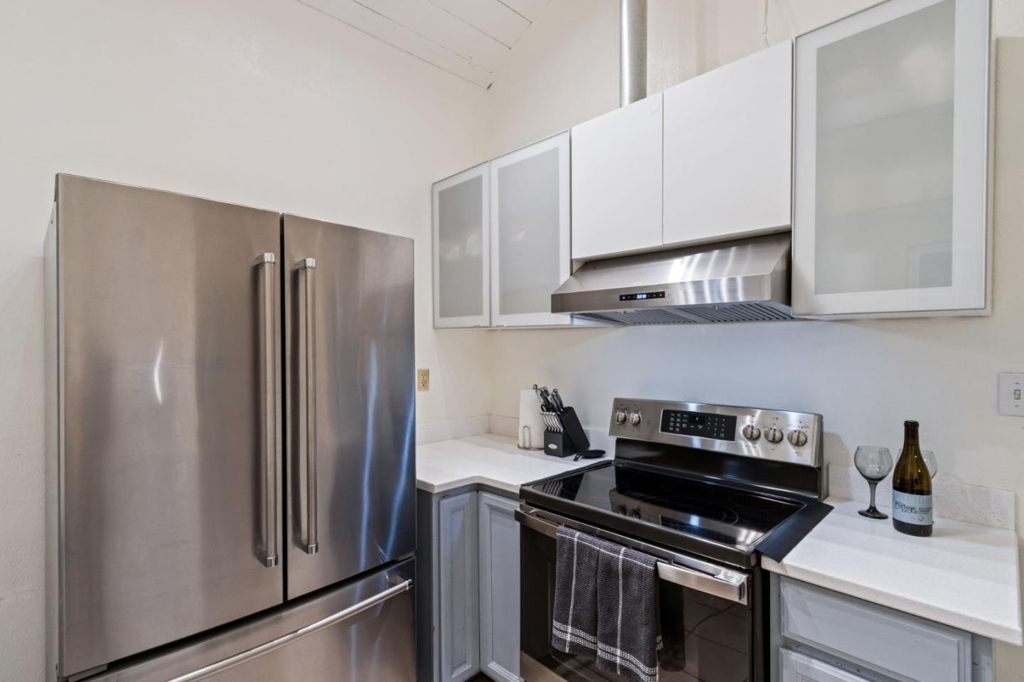 320 Fireside Road Boulder Creek, CA 95006 - Photo 13 of 36 a kitchen with stainless steel appliances granite countertop a refrigerator and a stove top oven