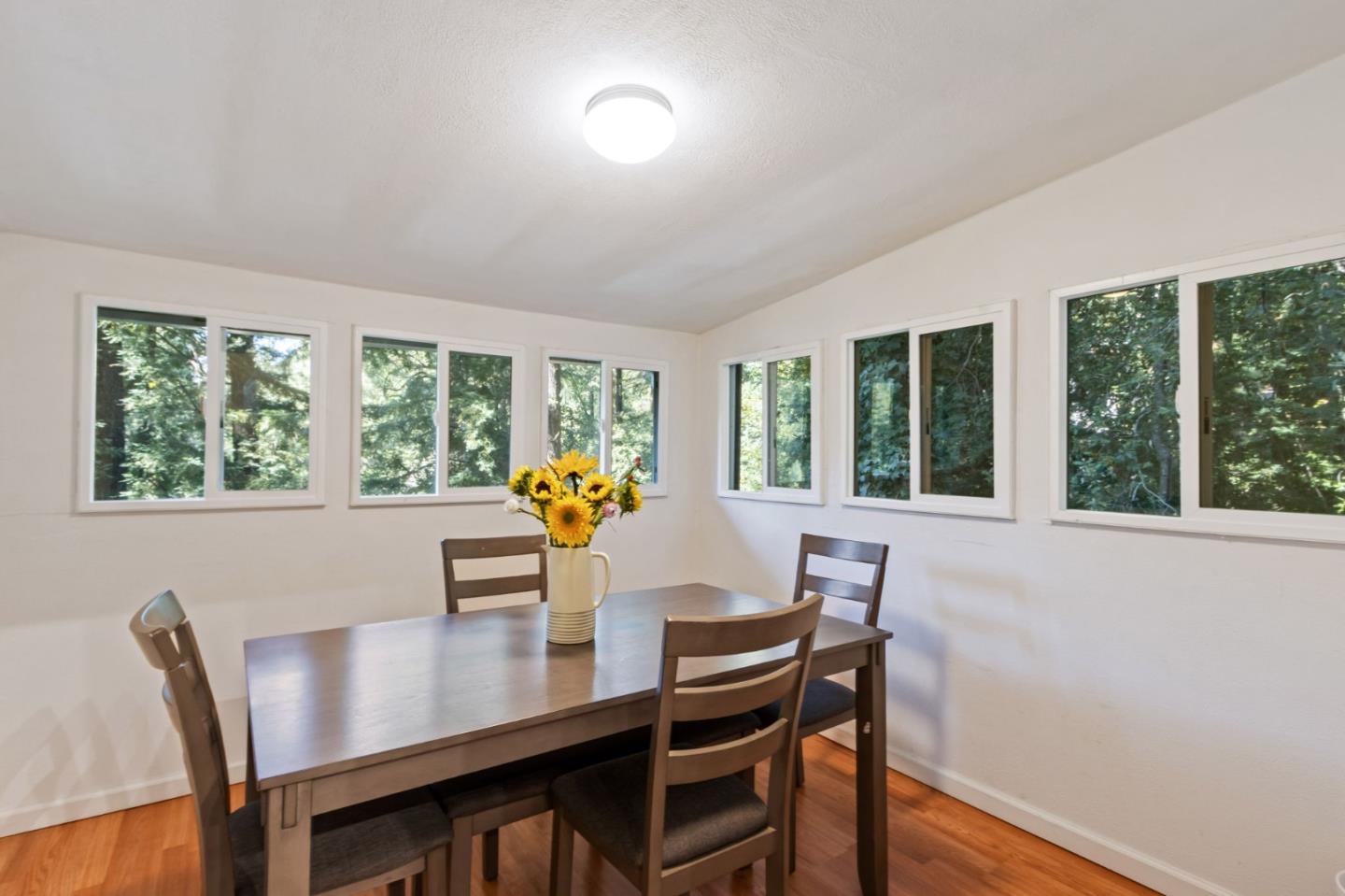 320 Fireside Road Boulder Creek, CA 95006 - Photo 14 of 36 a view of a dining room with furniture and a window