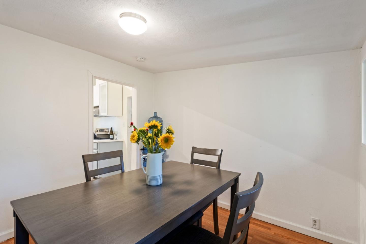 320 Fireside Road Boulder Creek, CA 95006 - Photo 16 of 36 a view of a dining room with furniture and wooden floor