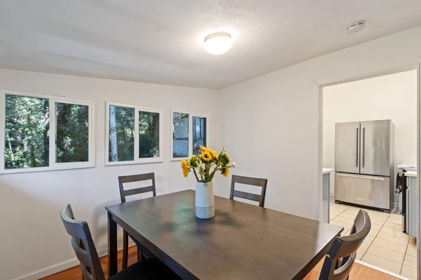 320 Fireside Road Boulder Creek, CA 95006 - Photo 17 of 36 a view of a dining room with furniture window and wooden floor