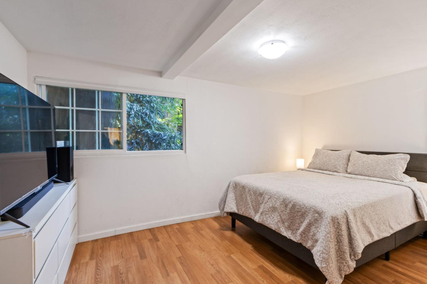 320 Fireside Road Boulder Creek, CA 95006 - Photo 22 of 36 a bedroom with a bed and window