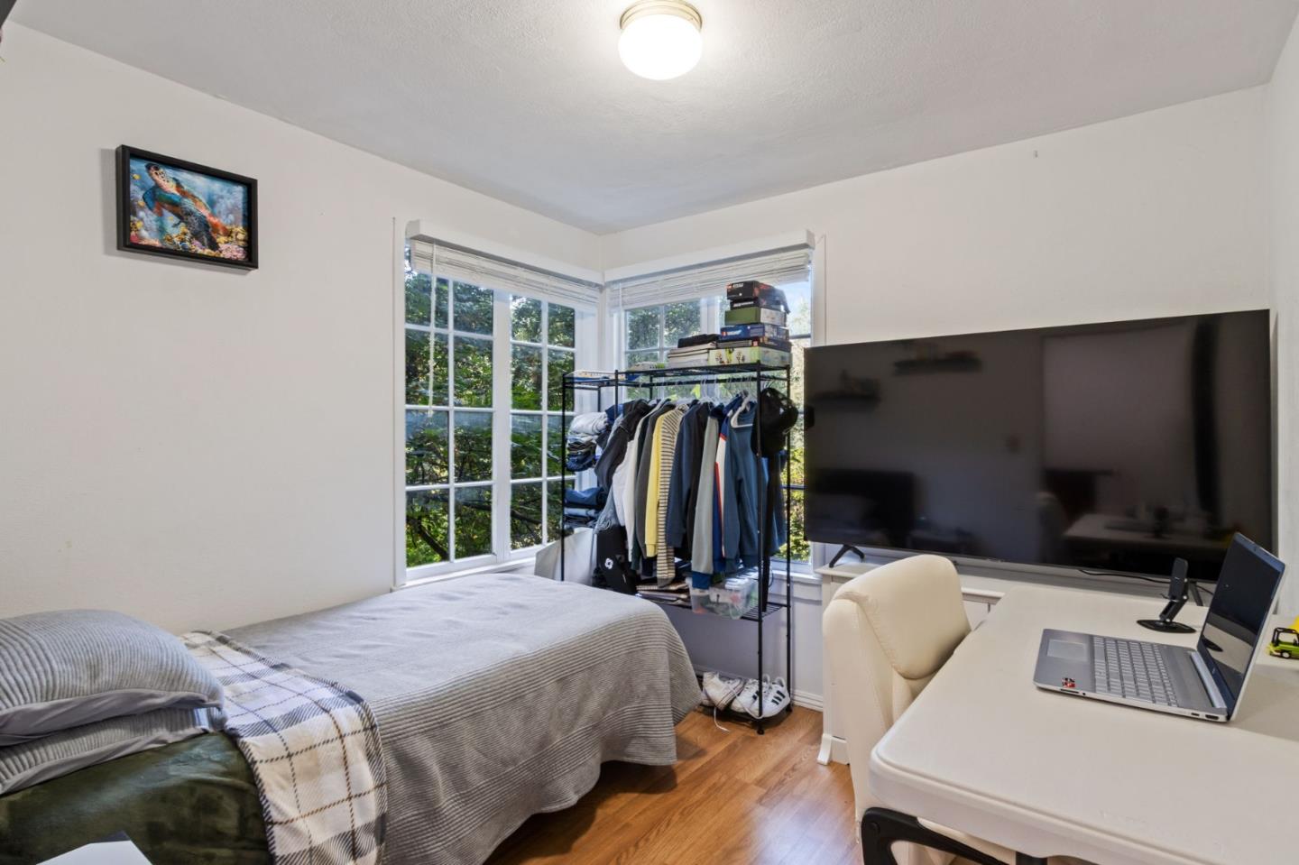 320 Fireside Road Boulder Creek, CA 95006 - Photo 25 of 36 a bedroom with a bed and a flat screen tv