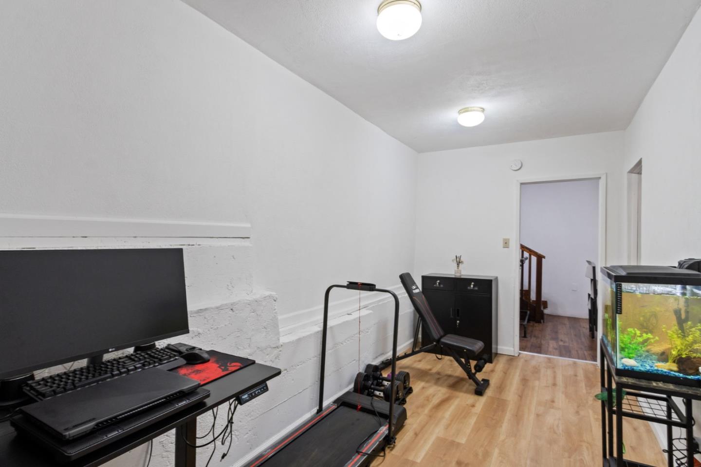 320 Fireside Road Boulder Creek, CA 95006 - Photo 28 of 36 a view of a workspace with furniture and a flat screen tv