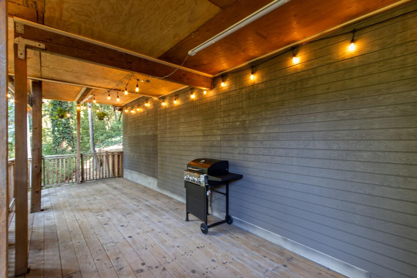 320 Fireside Road Boulder Creek, CA 95006 - Photo 34 of 36 a view of a porch with wooden floor and a table