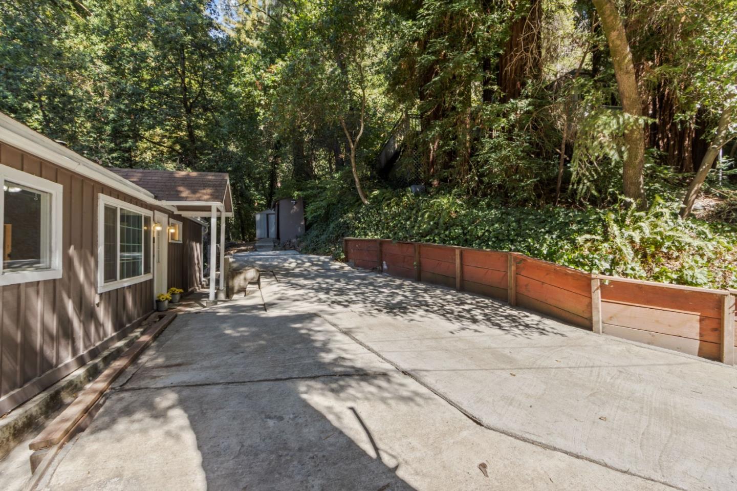 320 Fireside Road Boulder Creek, CA 95006 - Photo 4 of 36 a view of backyard with large tree and wooden fence