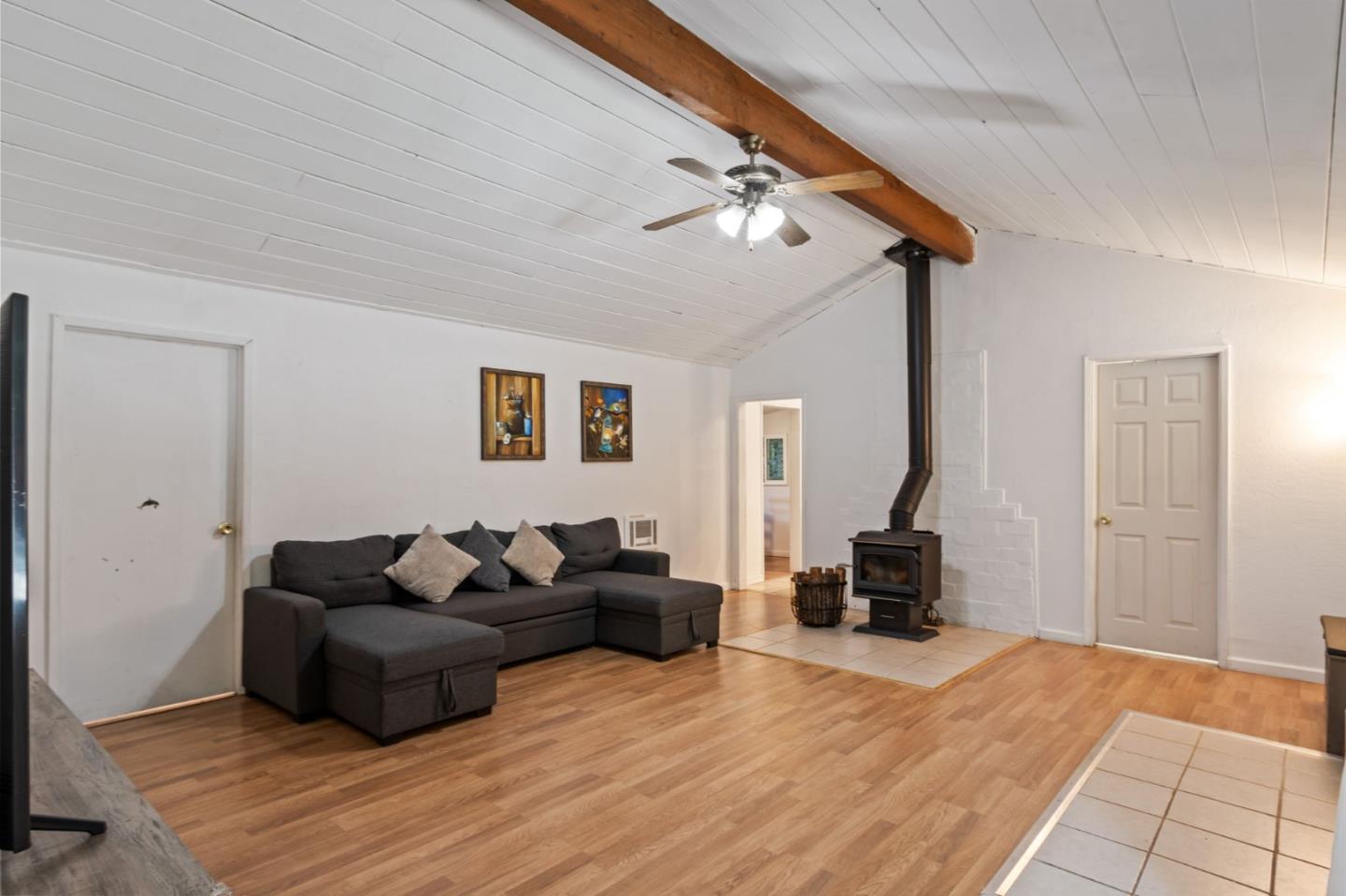 320 Fireside Road Boulder Creek, CA 95006 - Photo 6 of 36 a living room with furniture and a fireplace